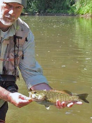 A fine smallmouth bass (bronzeback) taken on my Home Waters.  Photo taken and provided by my fishing friend and colleague, Tim Holschlag, aka, "Mr. Smallmouth", of Minneapolis, MN;  (<a href="http://www.smallmouthflyangler.com/site/flyangler/index.php">http://www.smallmouthflyangler.com/site/flyangler/index.php</a>).&amp;