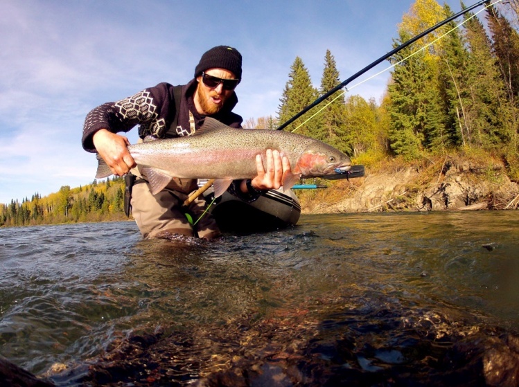 this fish hit my fly while i was in the middle of the river with my boat tied on my belt. it was a crazy fish and hard to land because of where i hooked it. i finally got it in when i walked up underneath a rock well. i had this fish take me into backing 