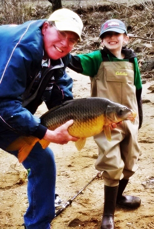 My grandson Josh with his first big fish a 12lb carp!  He is 8 and a fisherman already, spinning rod first got him a fly set up already for this year.