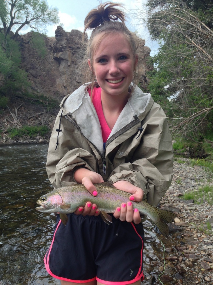 My youngest sister Leslie with her first ever fish on a fly! A beautiful rainbow! Needless to say she is Hooked!