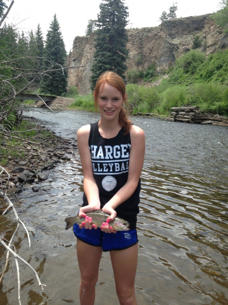 My sister Laura also likes to fly fish.  Nice little rainbow!