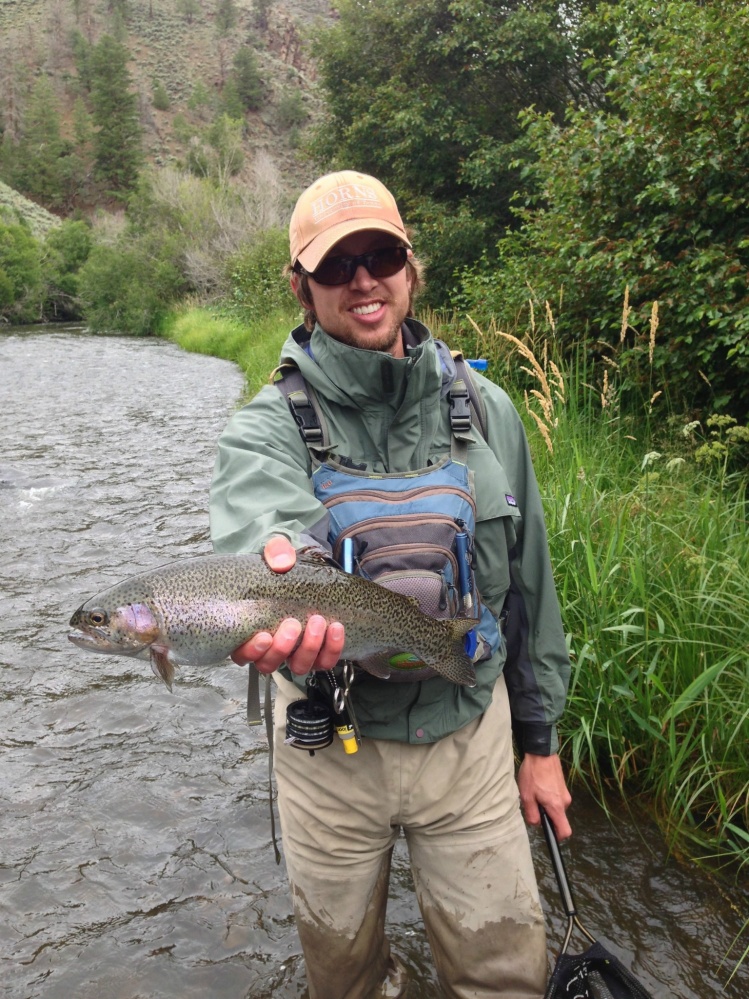 My friend Ryan with a big small creek rainbow.