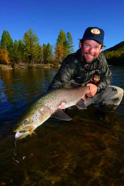 Guide, Charlie Conn, with a nice taimen at the Eg Urr Camp in Mongolia;