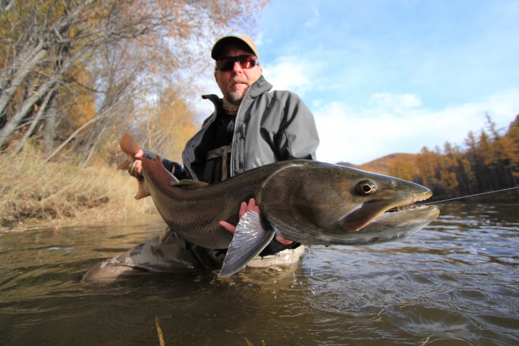 Tim with his handsome taimen - the biggest from our recent  trip to Mongolia. 53 inches. Congratulations!