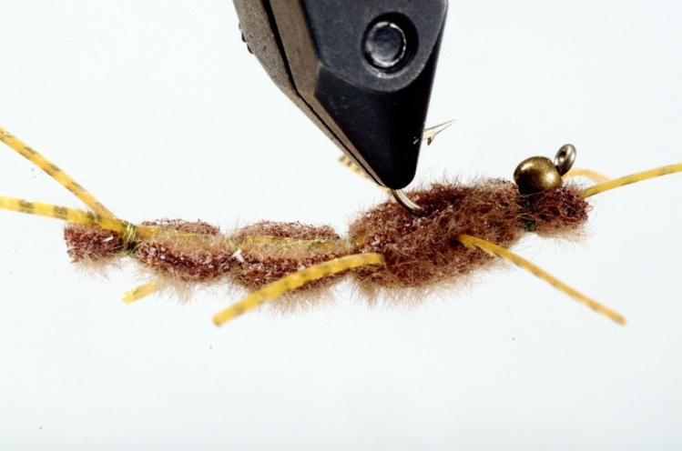 Open cell foam rubberlegs and bead, tied on a horizontal needle before mounting on a hook
