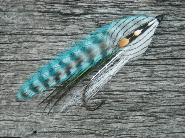 Hi All!..A good friend invited me to this site,so I thought I'd post a fly that I just finished tying.
I'm not sure who originated it ..maybe some guy named Parson Tom..HaHa!  I think it originated in Maine USA.

Dave

PS..Happy New Year everyone!