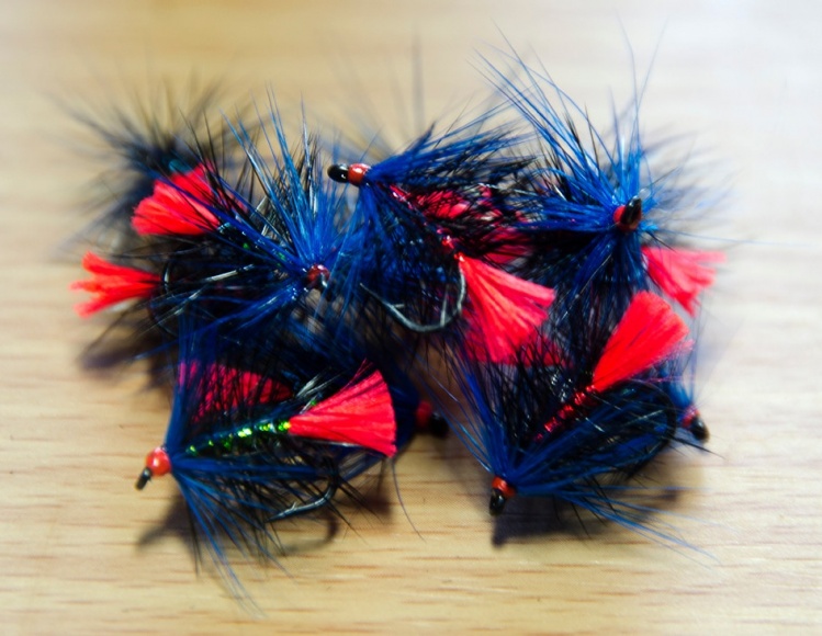 Blue Zulu variants with red or blue holographic tinsel bodies, in place of the usual seal's fur