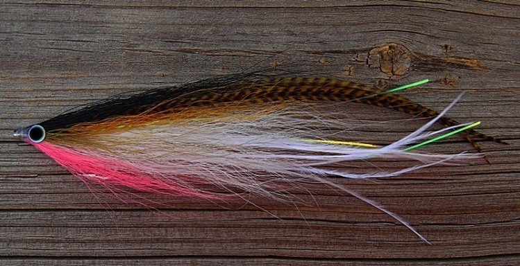 Another striped bass bunker fly with grizzly hackles off the top and some nice pink for the belly. Tail is bucktail with ostrich then one collar of bucktail tyed BTD (Bucktail Deceiver) style then two collars of bucktail Hollow Tye add in the grizzly and 