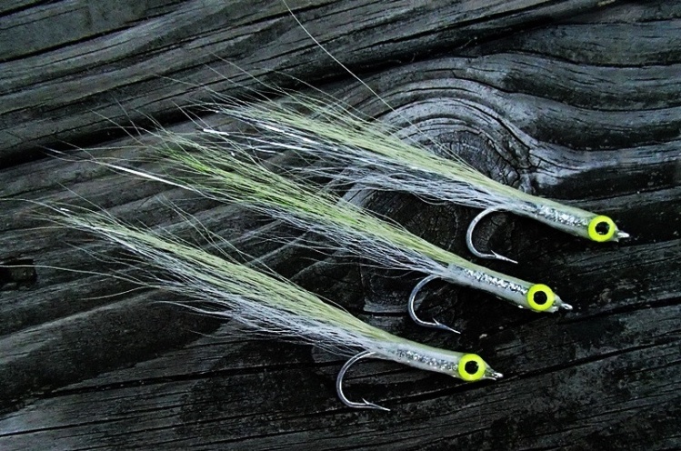 Spring means spearing or silversides that come inshore for stripers and bluefish. They appear in the bays and ocean in schools which bring the predators.  Very light olive on top and white on the bottom with silver braid in the middle and in the tail.
