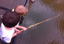 Kids learning to fish