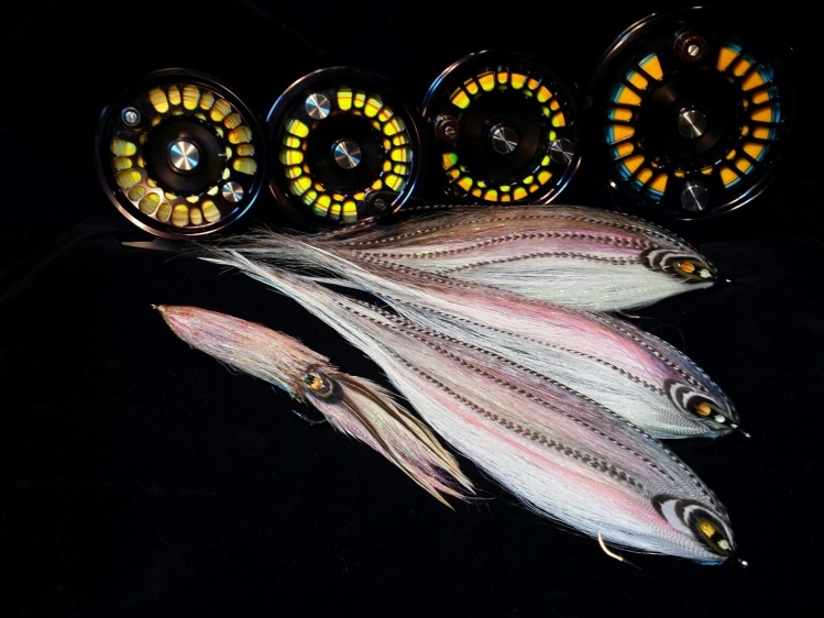 Striped mullet and squid are favorite forage for stripers along the northeast coast of the US. Mullet can often grow quite large and so a large fly is called for. The squid in the photo is approximately 10" long (25.4 cm), while the mullet flies are 16 - 