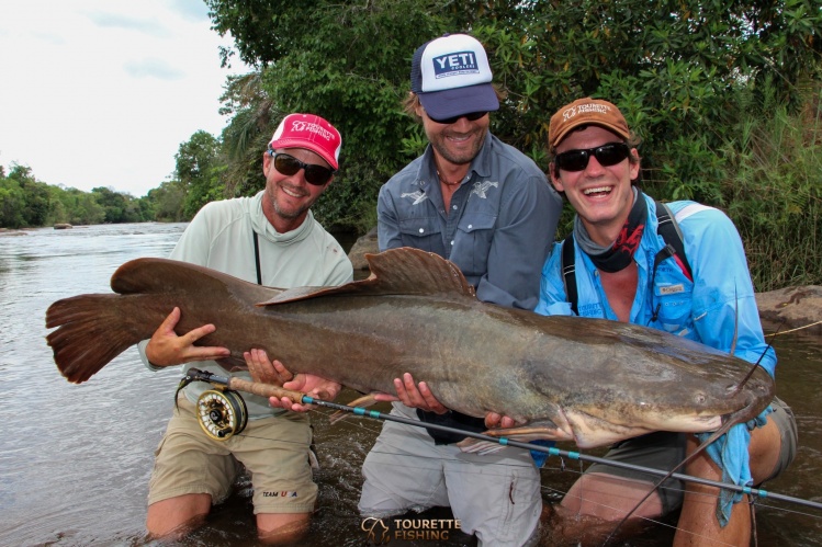 Oliver White(center) with possibly the largest Vundu catfish ever caught on fly! 