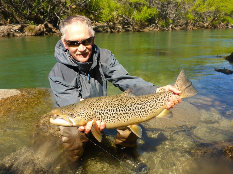 Denis Hall and his brown trout of 28 inches.