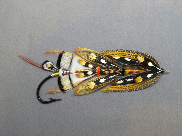Twisted Firestarter 8/0 XXL. Hook is 4.5 inches long. An artistic fly