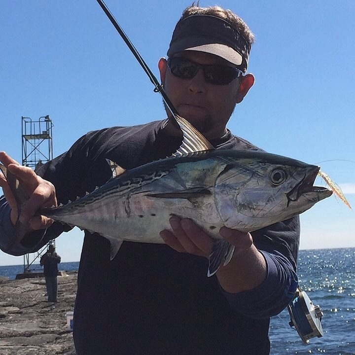My friend Andrew with the Holly Grail of North East fishermen, a shore caught little tunny or false albacore! They come in fast and leave in a heartbeat...way to go Andrew.