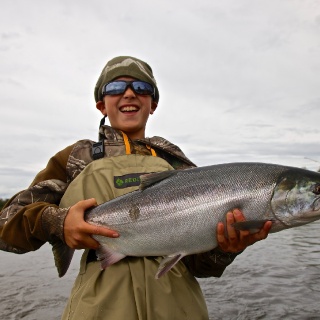 My 10 year old son River with his first silver salmon.....on his second cast ever in Alaska!
