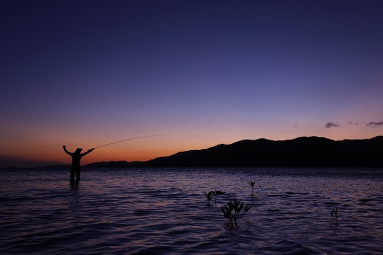 Fellow Patagonia Fish Ambassador K8 Taylor seizing a few last moments of light in Honduras.