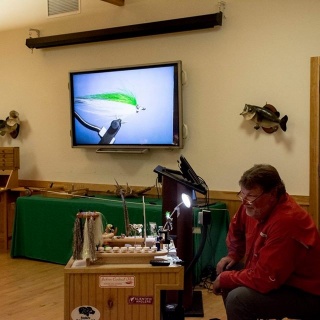 Capt. Gary at the bench teaching students on tying his Lil'hadden fly pattern