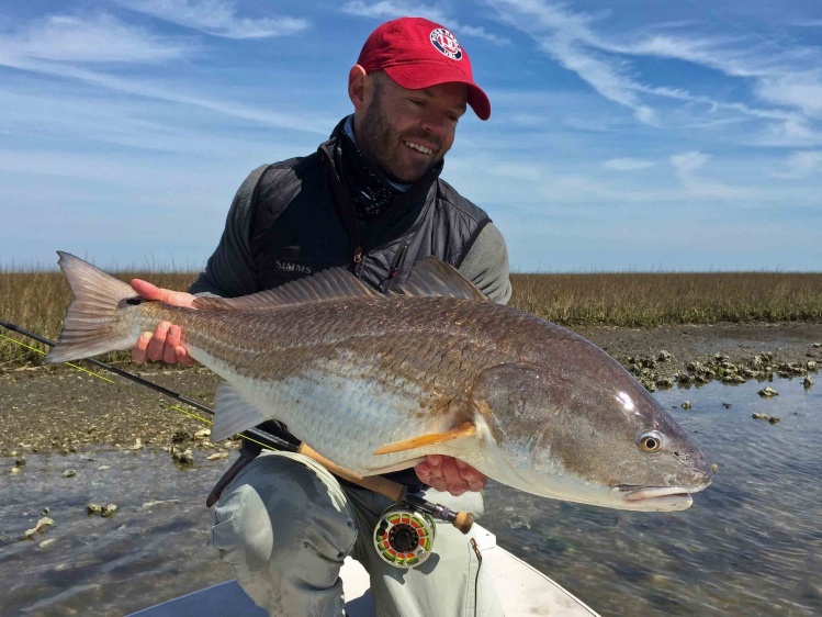 Landon Meyer with a pot-bellied Louisiana redfish 
www.lagunamadreoutfitters.com