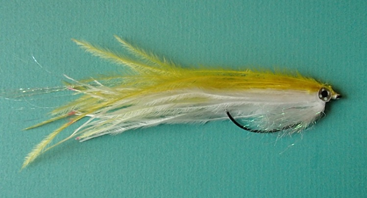 Another worm hook fly just like the black one posted a while back. EP pearl brush, white and yellow ostrich then some holographic eyes.