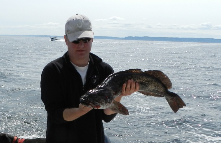 My friend Tye with a fish bigger than mine today, still small but a great fish.