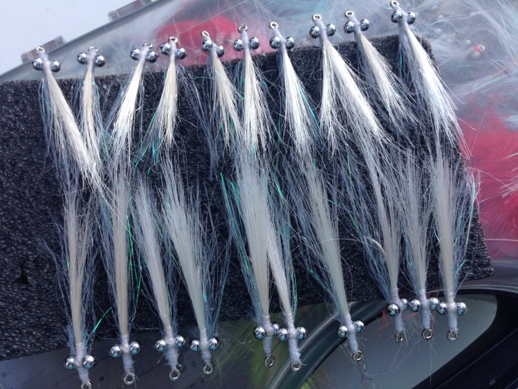 why tie one when you can tie 20
grey/white clouser - staple diet for Darwin Harbour bread and butter species - small GTs and mackerel, and small to medium queenfish to name just a few.
like then a little 'un shaved' and untidy around head area - adds su