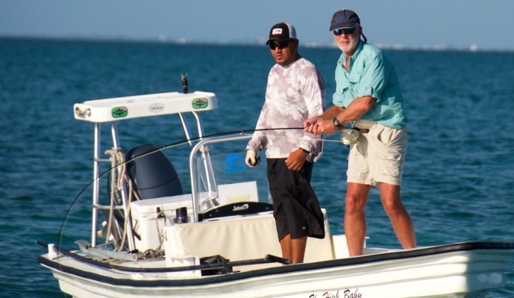 Angler Rees Poag fishing with The Fieldworkers Club battles a large tarpon on the Solar 912. The club partners with researchers and to pursue their mission - "We catch 'em, they tag 'em." 