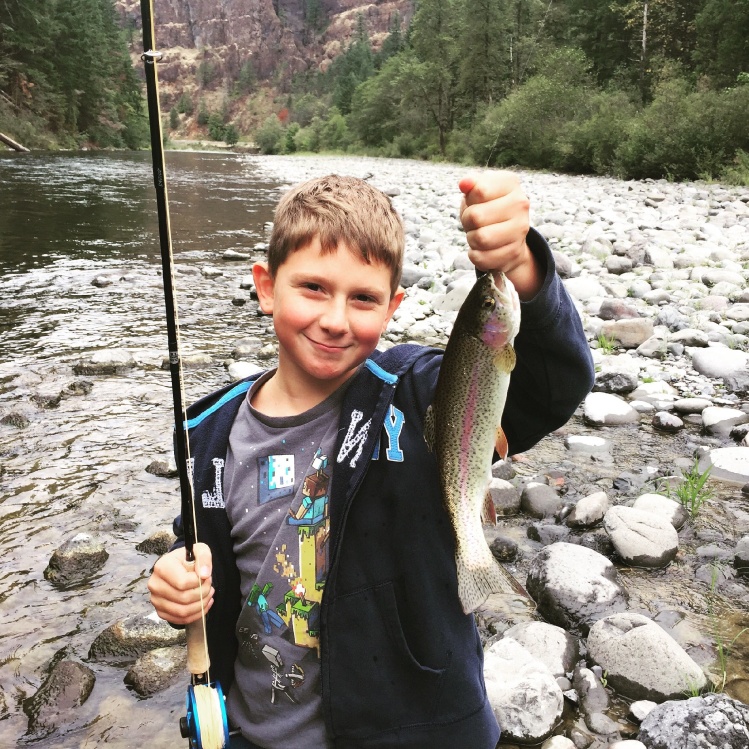 My sons first Rainbow on a fly rod. Using a #8 hand tied tan stonefly.