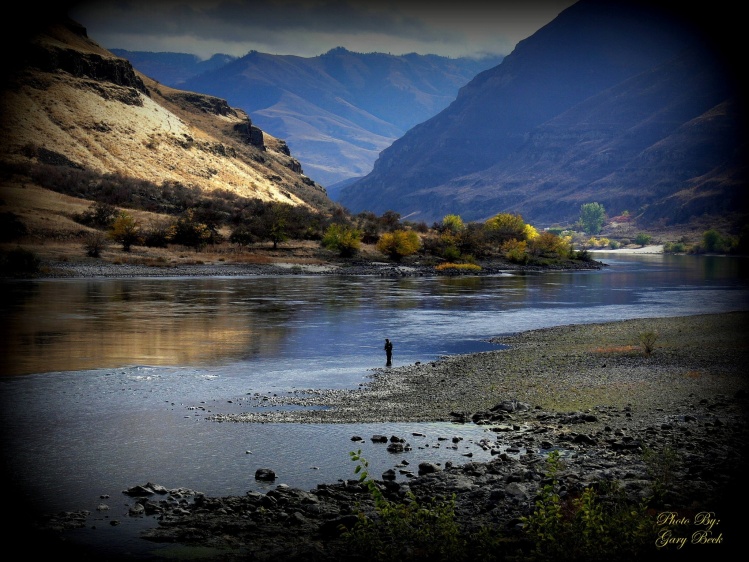 A  Spey fisherman on the Snake River near Lewiston, Idaho fishing for Stealhead.  Beautiful country..!!