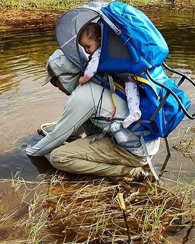 Terrence Tinucci eleasing a golden trout in the South Fork Kern River as his daughter Autumn Tinucci 