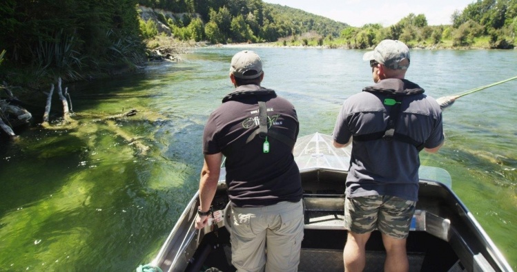 Casting from the boat to access ripples and eddies you otherwise can't get to on the Waiau River, New Zealand