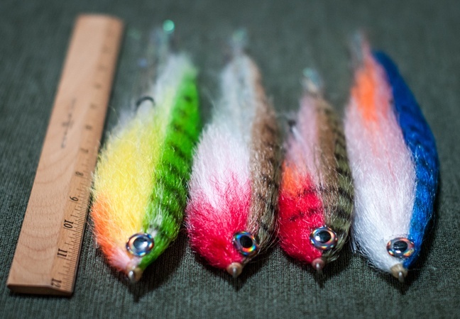 offshore flies with wig hair and holiday tinsel. rigged with wired double hook in rear.