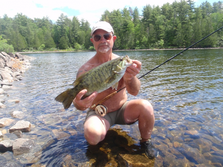 Look at that water and look at that smallmouth. One of this fly fisherman's many bass caught this particular morning