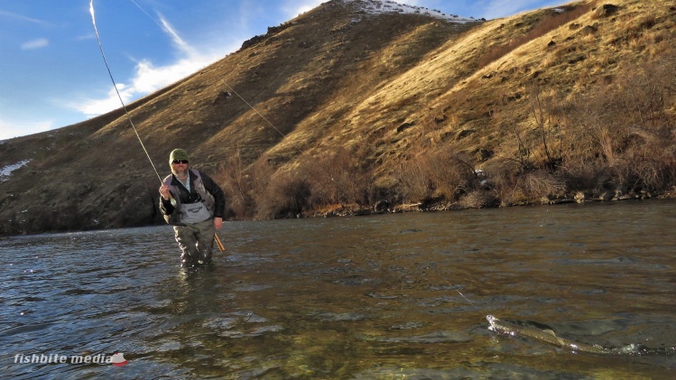 Chris Gerono slides a nice Boise River rainbow in for a quick release. #keepemwet