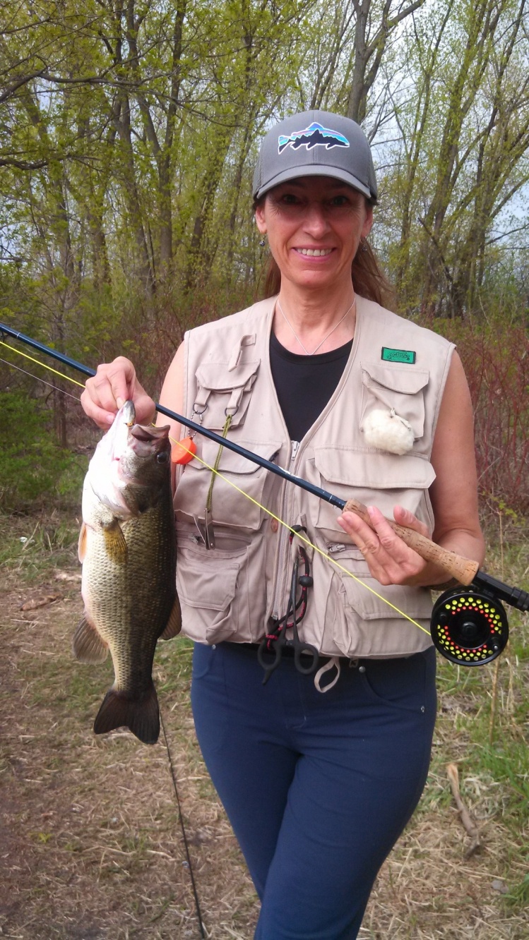 Mom with a good sized largemouth she caught on a Clouser 