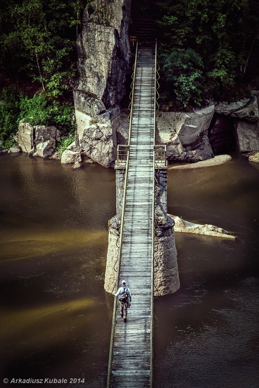 This wooden footbridge over the River Bobr somehow survived WWII, though the riverbed still remembers the violence with its shoals of sharded pottery.

© Arkadiusz Kubale 2014