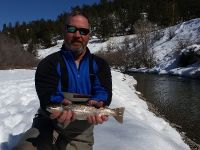 Shane with his first trout on a fly.