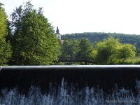 Church, wooden bridge, river and dam