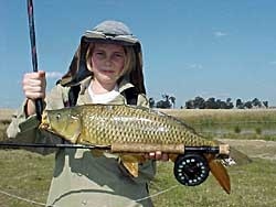 Daughter Kristilee with nice shallow water carp - simple and short roll cast with a bead chain eyed nymph