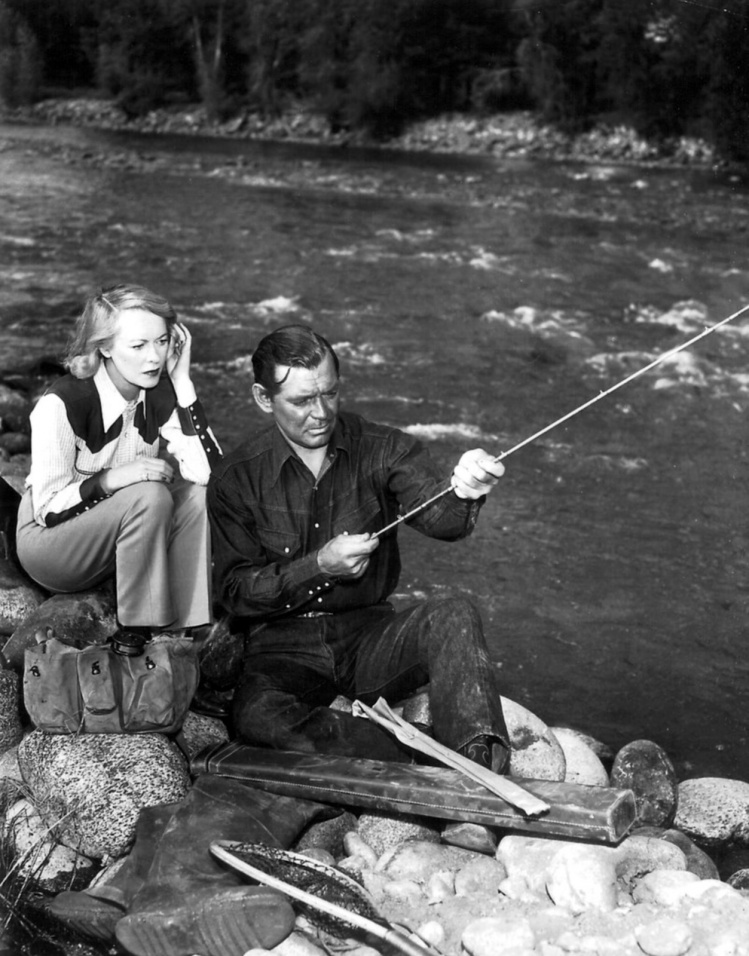 Clark Gable fly fishing with his  wife Sylvia Ashley